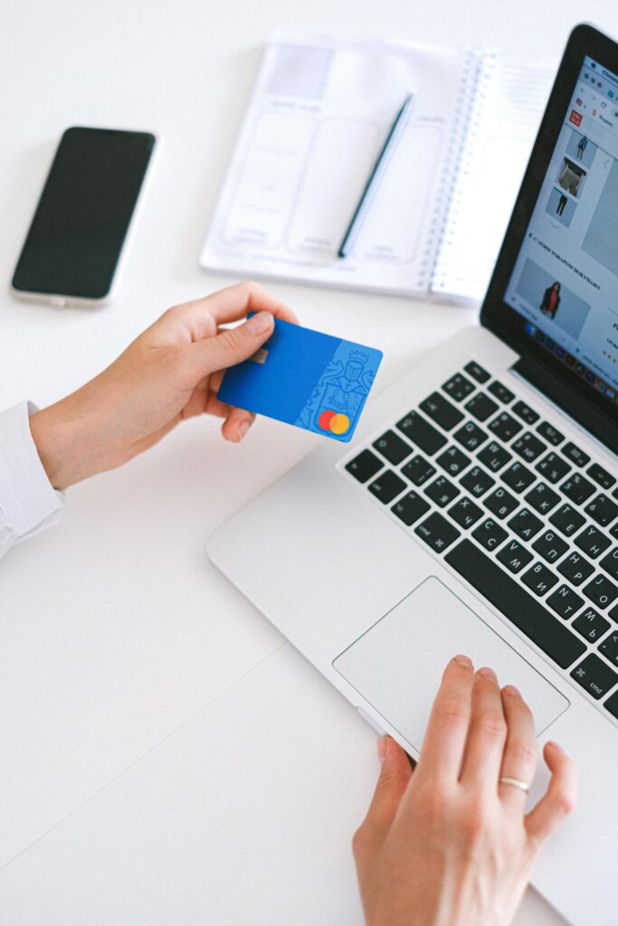 pexels-photo-4482900-4482900 Person Holding Bank Card